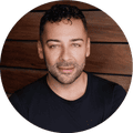 Man in black T-shirt, smiling
