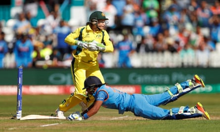 Harmanpreet Kaur dives to complete her century against Australia.
