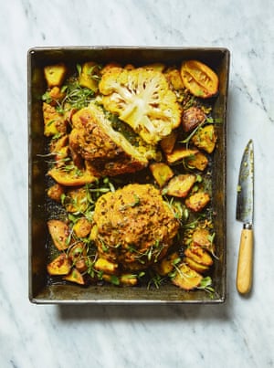 Serve this aloo gobi the middle of the table, with little bowls of yoghurt, almonds and coriander for sprinkling on top.