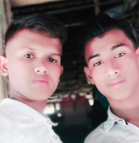 Two men from Myanmar wearing white shirts