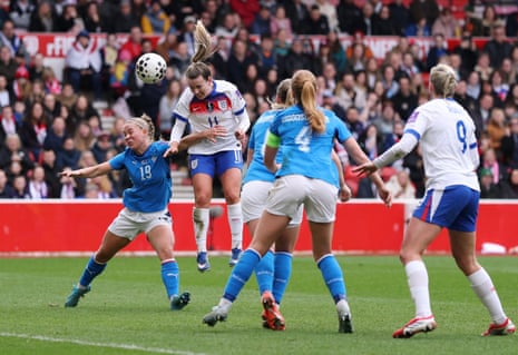 England's Lauren Hemp heads at goal and hits the post.