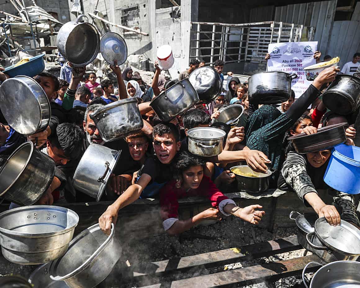 crowd of children with cooking pots