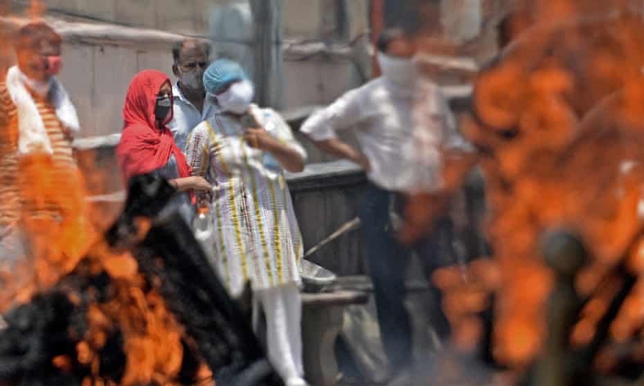 Pyres burn at a crematorium in Delhi