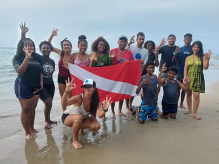 Young divers pose for a group photo on Puerto Viejo beach