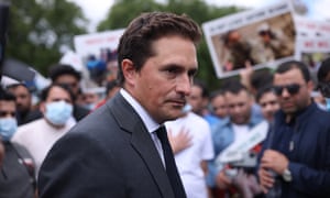 Johnny Mercer MP joins a group of former interpreters for the British and allied forces in Afghanistan on Parliament Square to protest on 18 August.
