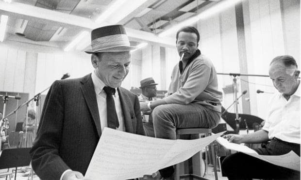 Frank Sinatra, Quincy Jones and producer Sonny Burke review an arrangement.