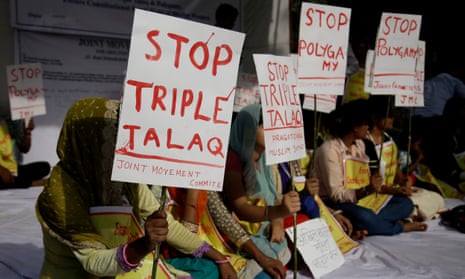 Activists hold placards during a protest against ‘triple talaq’ in New Delhi, India