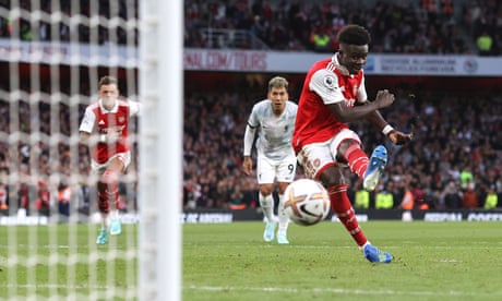 Bukayo Saka scores his second and Arsenal’s third from the penalty spot against Liverpool