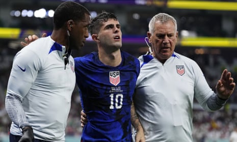 Christian Pulisic is helped off the pitch after suffering an injury while scoring for the United States against Iran