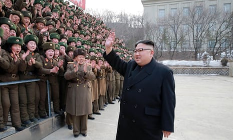 The North Korean leader, Kim Jong-un, waves as he inspects a Korean People’s Army unit at an undisclosed location.
