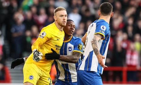 Brighton & Hove Albion’s goalkeeper Jason Steele is congratulated by team mates Pervis Estupinan and Lewis Dunk after saving a penalty kick during the Premier League match between Nottingham Forest and Brighton & Hove Albion at City Ground.