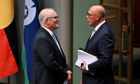 Former prime minister Scott Morrison speaks to opposition leader Peter Dutton after delivering his valedictory speech, 27 February, 2024.