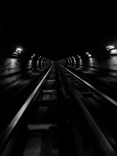 A black-and-white photo of a railway tunnel