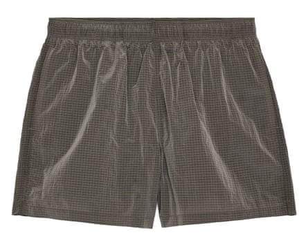 A pair of Arket swim shorts in grey.