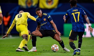 Manchester United’s Anthony Martial in action with Villarreal’s Etienne Capoue, as Fred watches.