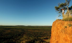 A man at a cliff edge in outback Australia