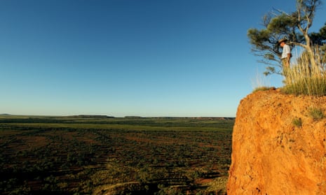 A man at a cliff edge in outback Australia