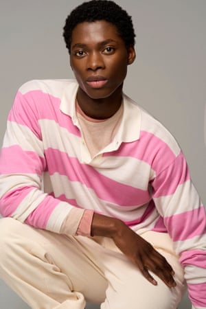 Model wears pink and white stripe knit