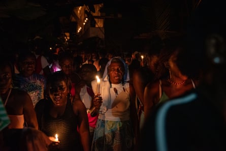 Inhabitants of the Juntas village of the Yurumanguí celebrate at night, holding candles