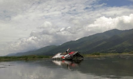 A man drying items in a flooded area at Inle Lake, in Myanmar’s southern Shan state.