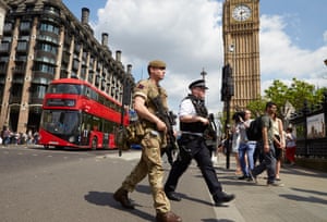 The army join armed police in patrolling the area around parliament, Westminster, London