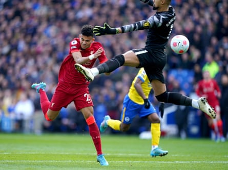 Luis Díaz scores his side’s first goal but is poleaxed by the Brighton goalkeeper as Liverpool win 2-0