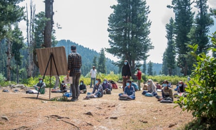 Teacher and students in outdoor class