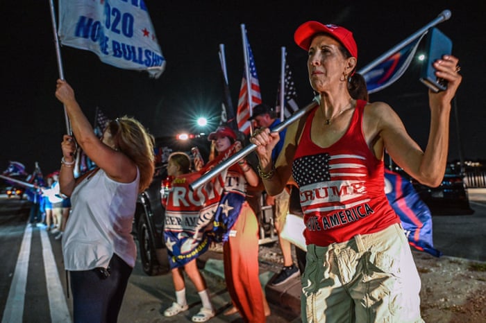 Supporters of former US President Donald Trump outside his residence last night.