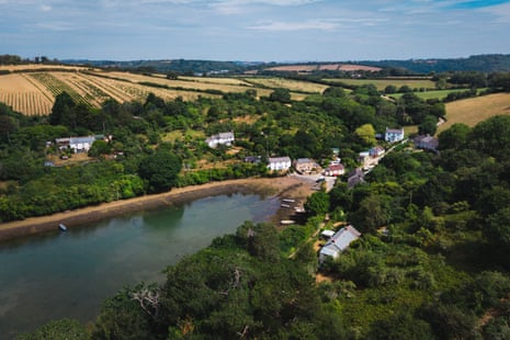 An aerial view of a river inlet in a rural setting