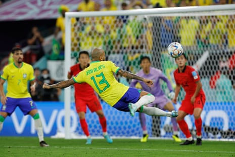 Brazil's Dani Allves has an acrobatic pop at goal.