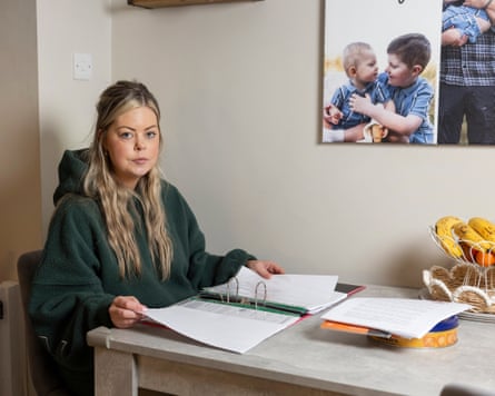 Alison sits astatine nan room array pinch a ample files unfastened successful beforehand of her