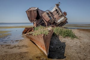 A broken boat beached on the sand