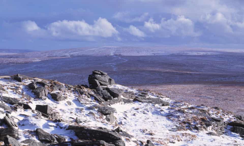 Rock formations on a snow covered landscape, Yes Tor, Dartmoor, Devon, England.