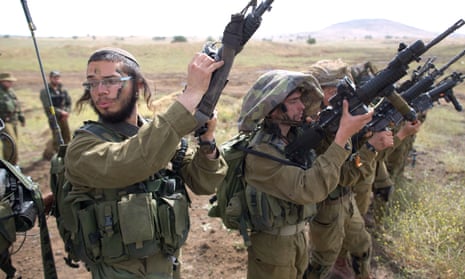 Israeli soldiers of an ultra-Orthodox battalion take part in annual training in the Golan Heights, near the Syrian border. 