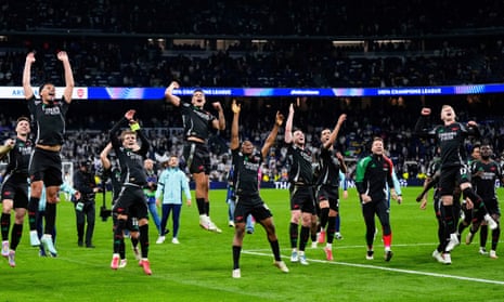 Arsenal celebrate after defeating Real Madrid in the Champions League quarter-final.