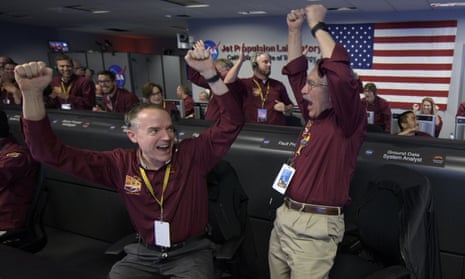 Mars InSight Mission<br>PASADENA, CA - NOVEMBER 26: In this handout provided by NASA, Mars InSight team members Kris Bruvold (L) and Sandy Krasner react after receiving confirmation that the Mars InSight lander successfully touched down on the surface of Mars, inside the Mission Support Area at NASA's Jet Propulsion Laboratory on November 26, 2018 in Pasadena, California.  InSight, short for Interior Exploration using Seismic Investigations, Geodesy and Heat Transport, is a Mars lander designed to study the "inner space" of Mars: its crust, mantle, and core. (Photo by Bill Ingalls/NASA via Getty Images)