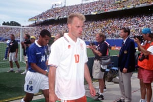 Dennis Bergkamp walks dejectedly off the pitch at the end of the match