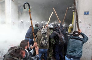 Farmers clash with riot policemen outside the Agriculture Ministry in Athens, Greece, 12 February 2016. Farmers from all over Greece organise a massive protest in central Athens requesting that the government withdraws its proposed social security and pension reform plan. Protesters are expected to meet in Athens and walk towards the Parliament on Syntagma square, where they will set up tents to house farmers who will remain there for the entire weekend. EPA/PANTELIS SAITAS