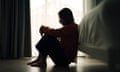 Woman silhouetted against a window