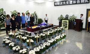 Funeral ceremony for Liu Xiaobo, who died on Thursday of liver cancer at 61. His wife, Liu Xia, is on the right, wearing sunglasses.