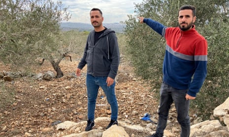 Ibrahim Abu Hijleh, 30, and Majdi Sahaban, 28, in olive groves on the outskirts of Deir Istiya.