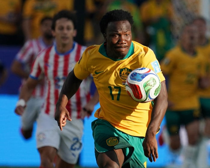 Socceroos secure place in World Cup last 32 after nerve-shredding draw with Paraguay
