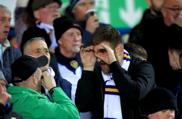 Leeds fans make binocular gestures in the stands as the club’s 'Spygate' feud with Derby simmered this season.