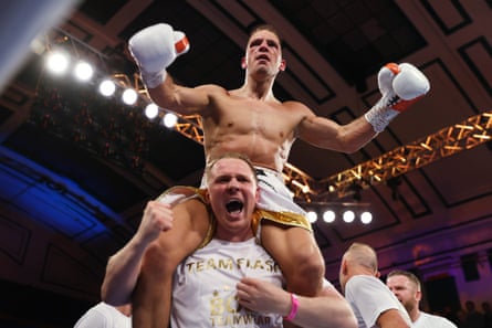 Ashley Lane celebrates victory with his head coach Kieran Farrell.