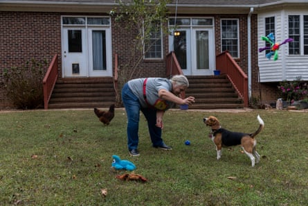 Donna Pinkston tosses a toy to Daisy at her home in North Carolina.