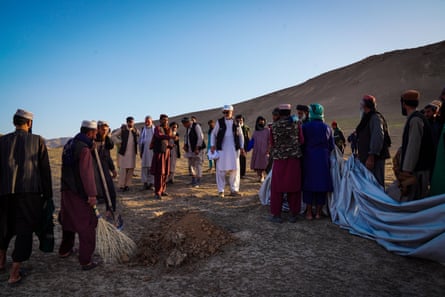 Baghlan Province, Afghanistan. Local people dig pits to bury Moroccan locusts