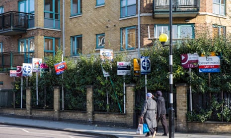 Block of flats in Hackney with lots of to let and for sale signs outside