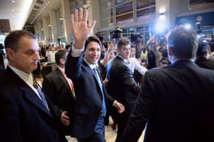 Justin Trudeau waves to members of the media and summit volunteers as he leaves after a press conference at the Apec summit in Manila. The new Canadian prime minister was the star draw.