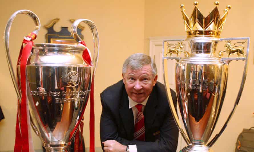 Sir Alex Ferguson with the UEFA Champions League trophy and the FA Barclays Premier League trophy in 2008