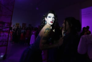 Drag artist Violet Chachki stands in a spotlight
